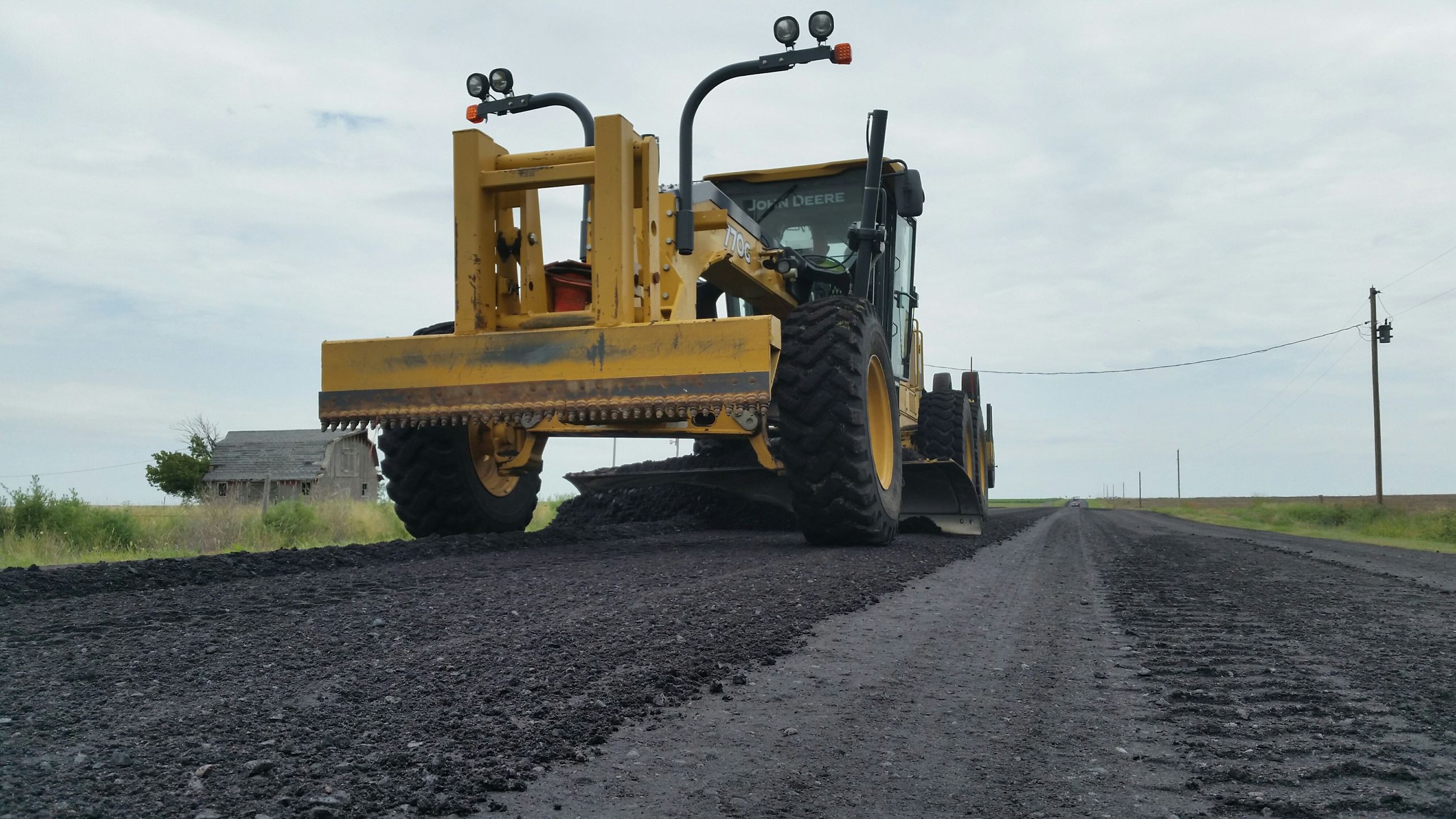 Motor Grader leveling asphalt